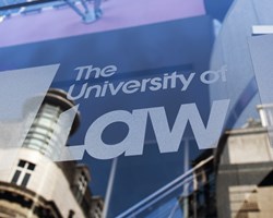 Close up The University of Law logo on Leed's campus exterior